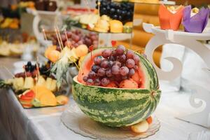 various dessert with fresh fruit on buffet line, sweet. photo