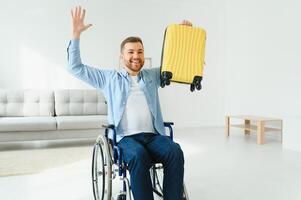 A person with disabilities at home with a suitcase is preparing for vacation. Leisure concept photo