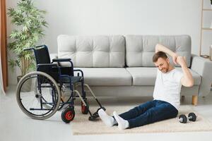 Disabled sportsman doing stretching and exercises on wheelchair background. Life of a disabled person photo