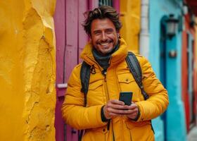 AI generated Man in Yellow Jacket Standing in Front of Colorful Buildings in Urban Setting. A man wearing a yellow jacket stands in front of vibrant, multi-colored buildings in a busy cityscape. photo