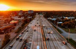 Aerial View of Miami City Street at Sunset. An incredible aerial view of Miamis city streets at sunset, capturing the vibrant energy and captivating beauty of the urban landscape. photo