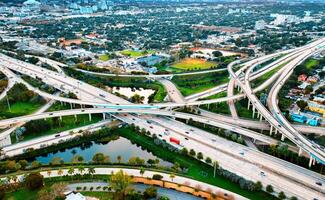 Aerial View of Miami Highway Intersection in the USA. This image showcases an intersection of highways in Miami, USA from an elevated perspective. photo