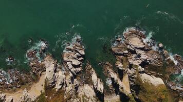 Traveler in kayak glides along rocky cliffs aerial view Kayak means to explore exotic nature. Kayak embodying active and healthy lifestyle Adventure that combines thrill and tranquility. video