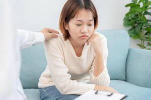 psychiatrist holds shoulders while discussing life and family issues. doctor encourages and empathy woman suffers depression. psychological, save divorce, Hand in hand together, trust, care photo