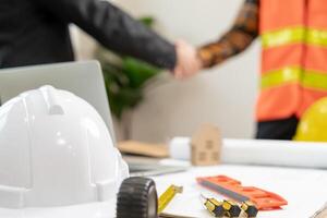 Construction team hands shaking greeting start up plan new project contract in office center at construction site, industry ,architecture, partner, teamwork, agreement, property, contacts. photo