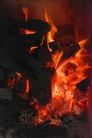 Full fire and sparkling embers in a barbecue. photo