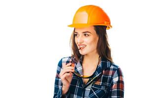 Woman Wearing a Hard Hat and Checkered Shirt photo