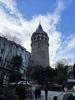 16 of April 2023 - Istanbul, Turkey - Galata Tower against a cloudy sky photo