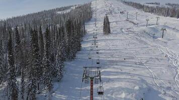 Aerial. the slopes of a mountain with numerous ski and snowboard marks video