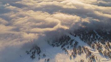 Aerial. Beautiful sunset low clouds in Sheregesh covered part of the ski slopes video