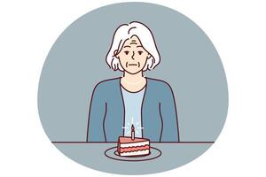 Elderly woman sits at table with piece of cake and suffers from absence of relatives. Vector image