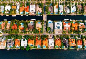 Aerial View of Miami City With River Cutting Through. An expansive view of Miami city captured from above, showcasing the river flowing through its urban landscape. photo