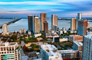 Aerial View of Miami, USA - Towering Cityscape With Skyline Buildings. Capture the breath-taking panoramic view of Miami, USA from above, showcasing the towering skyline and impressive cityscape. photo
