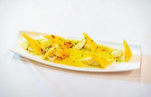 A Plate of Freshly Sliced Bananas. A white plate topped with sliced up bananas photo