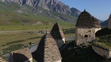 Overlooking aerial City of Dead Dargavs North Ossetia City of Dead window into ancient history. City of Dead archaeological marvel Where every ruin tells story legacy etched in time. video