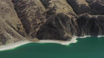 Aerial. the turquoise surface of lake and the beautiful shore with steep cliffs video