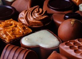 a close up of a variety of chocolates photo