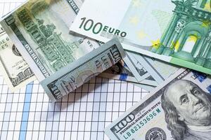 A Stack of Currency on a Table. A pile of money sitting on top of a table photo