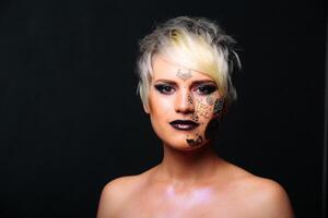 A Striking Woman with White Hair and Dramatic Black Makeup. A woman with white hair and black makeup photo