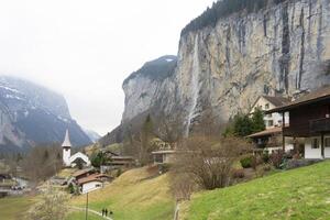 a mountain with a waterfall photo