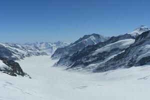 a mountain range with snow on it photo