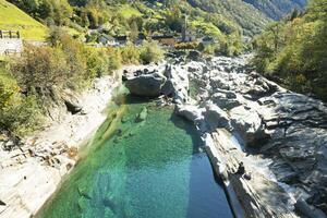 a river that is surrounded by rocks photo