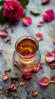 AI generated Delicate Rose Petal Tea in a Transparent Glass Cup photo