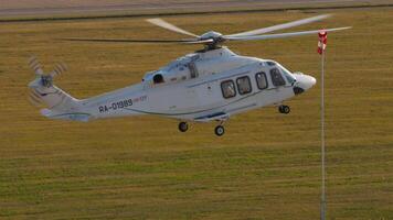 KAZAN, RUSSIAN FEDERATION, AUGUST 5, 2022. Helicopter Agusta-Westland AW-139 of Tulpar airlines landing in Kazan International airport video