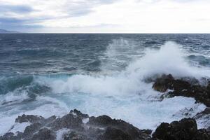 a large body of water with waves photo