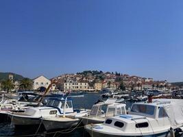 Croatian island Brac. Summer holidays. Travel by sailboat. Port of Brac. photo