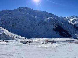 a view of a mountain range with snow covered slopes photo