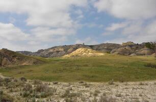 Yellow Mound in the Badlands Of the Dakotas photo