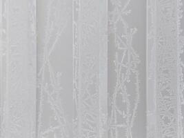 winter frosty background with snow patterns and frost on white texture photo