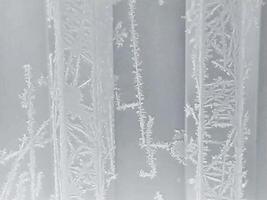 winter horizontal frosty background with snow patterns on ribbed texture photo