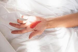 Heart shape drawing on the palm of hand. photo