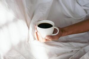 Time to coffee in bed. Wake up early in the morning. photo