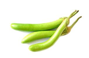 Green long eggplants isolated on white background. Concept, agriculture crop in Thailand. Food ingredient which can be cooked for variety delicious menu. Healthy eating, high fiber, reduce cholesterol photo