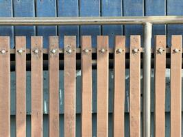 old iron and wooden fence in a sunny day photo