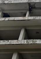 abandoned concrete building with a window photo