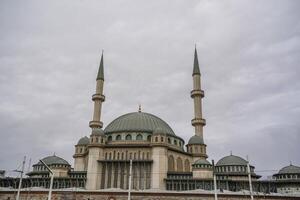 Taksim Square Mosque in front of Republic Monument Istanbul Turkey photo