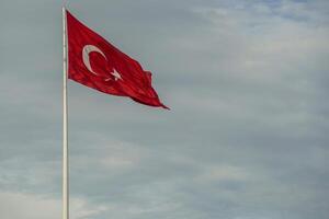 Trukish flag in Ortakoy district view from Istanbul Bosphorus cruise photo