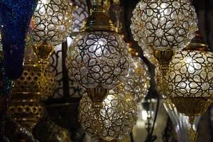 Colorful turkish glass lamps chandelier with glass details in Istanbul grand bazar Turkey photo