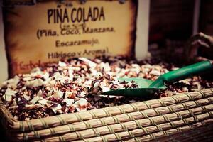 Spices, seeds and tea sold in a traditional market in Granada, Spain photo