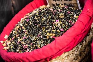 Spices, seeds and tea sold in a traditional market in Granada, Spain photo