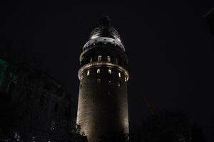 galata tower in istanbul turkey under restoration niht view photo