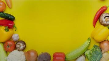 Moving vegetables on yellow background - stop motion animation, 4k, place for title video