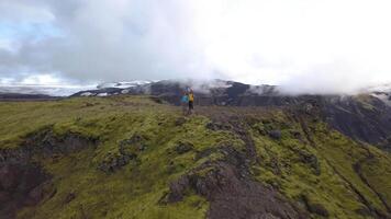 Tourists on the top in Iceland. The amazing nature of Iceland. 4k video