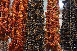 Dried eggplants , peppers , cucumbers and okra at the bazaar Istanbul market. Dried vegetables for to use at winter time. photo