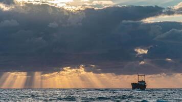 The movement of clouds over the sea and the ship stranded. Time lapse. video