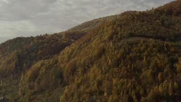 Drone flies over mountains and the village in the morning in autumn video